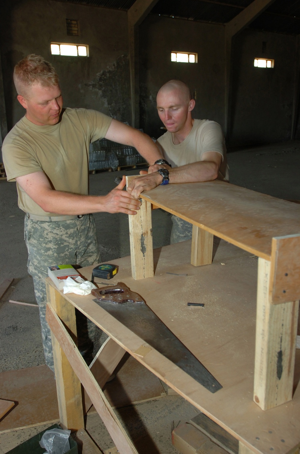 Soldiers Build Bookshelf for Operations Center in Iraq
