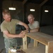 Soldiers Build Bookshelf for Operations Center in Iraq