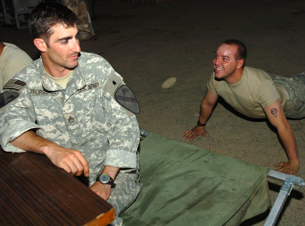 Soldier Celebrates Comrade's Birthday with Push-ups at Coalition Outpost