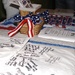 Audience Members Sign Quilt for Injured Troops Overseas