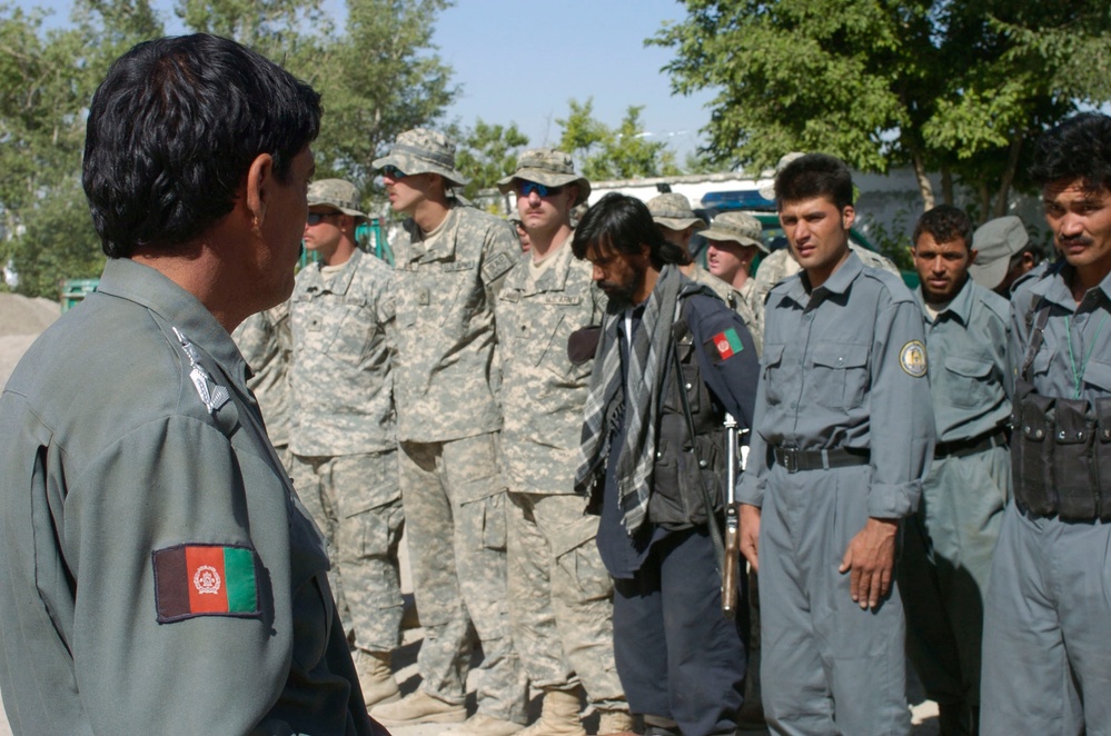 Afghan Police and U.S. Soldiers Gather at Qarabagh District Center