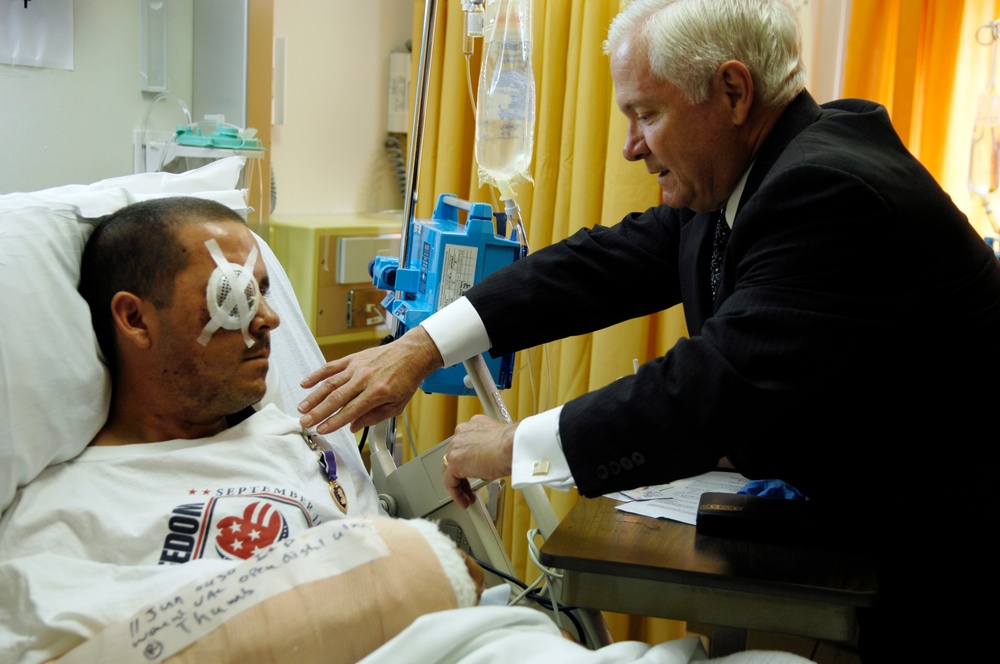 Gates Presents Purple Heart to Wounded Soldier in Germany