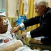 Gates Presents Purple Heart to Wounded Soldier in Germany