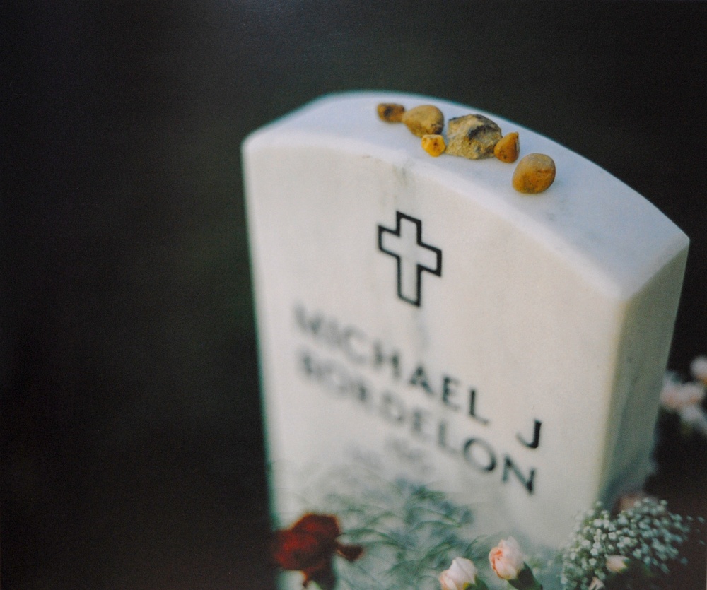 Fallen Soldier's Grave Adorned with Symbols of Remembrance