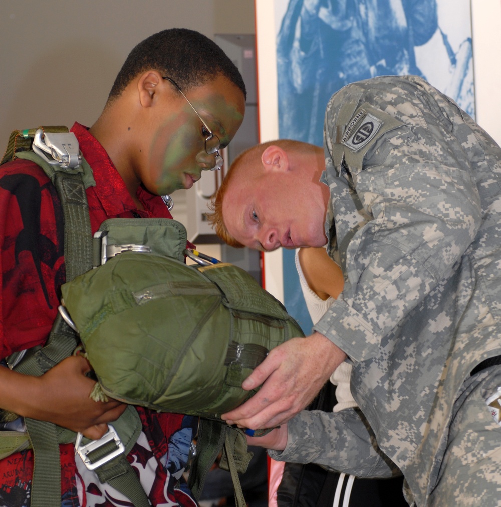 Army Paratrooper Demonstrates Parachute Rigging at Public Service Event