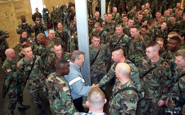 Rumsfeld Visits Kosovo Troops, Dons Army PT Jacket