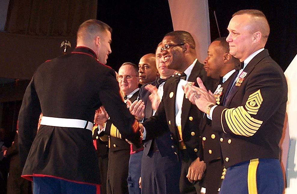 Coast Guard Master Chief Congratulates Marine Sergeant as USO Honors Top Service Members