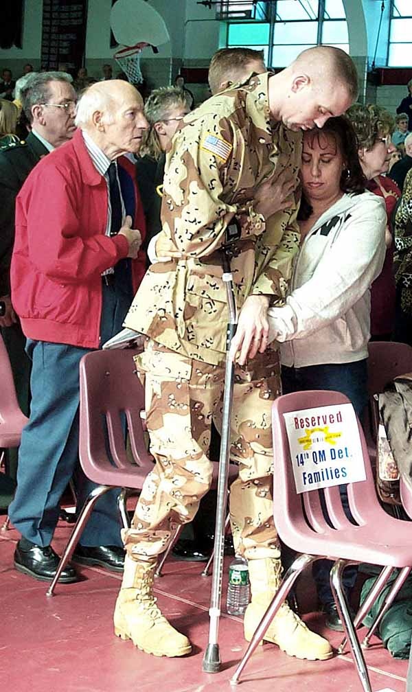 Disabled Veteran Salutes at Memorial Service for Fallen Comrades
