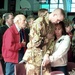 Disabled Veteran Salutes at Memorial Service for Fallen Comrades