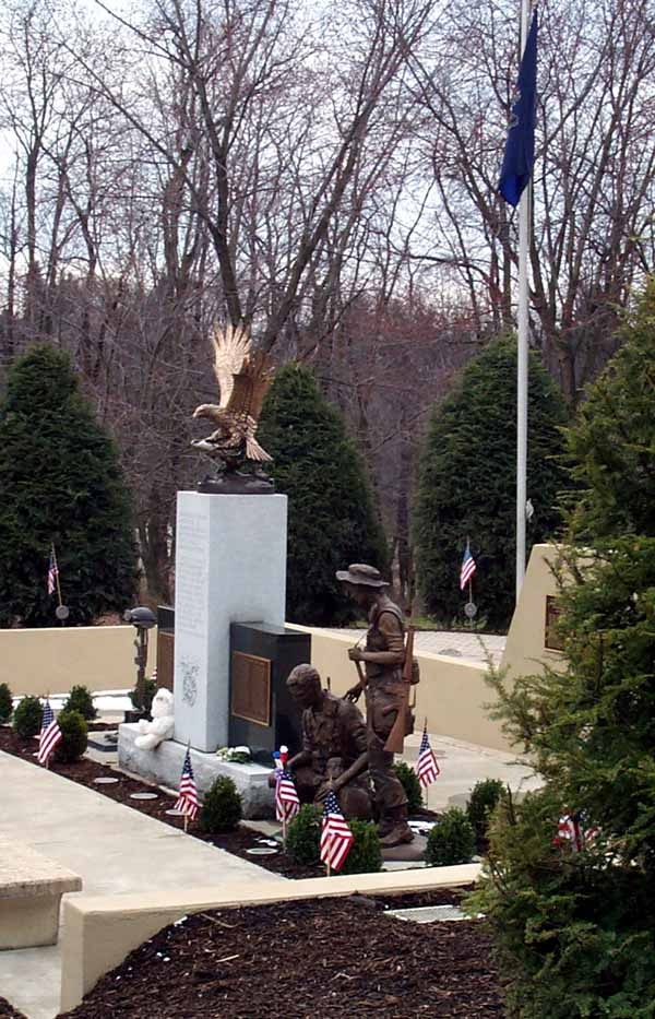 Solemn Reflection: Bronze Soldiers Honor Fallen Comrades at Desert Storm Memorial
