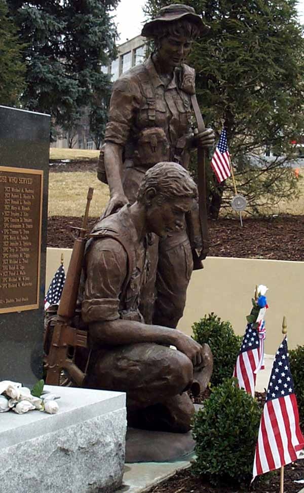 Solemn Tribute: Bronze Soldiers Reflect on Fallen Comrades