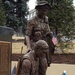 Solemn Tribute: Bronze Soldiers Reflect on Fallen Comrades