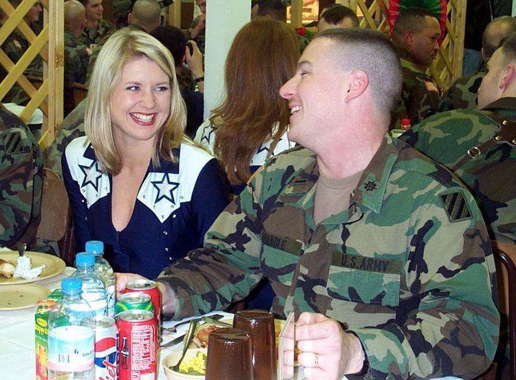 Army Officer Chats with Dallas Cowboy Cheerleader in Bosnia Dining Facility