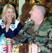 Army Officer Chats with Dallas Cowboy Cheerleader in Bosnia Dining Facility