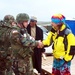 Musician and Baseball Legend Spread Cheer to Troops in Kosovo