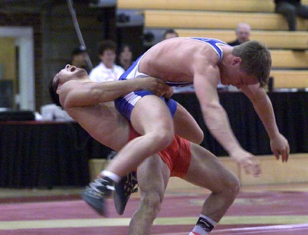 Chinese Wrestler Battles Finnish Opponent in Greco-Roman Match