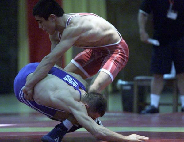 Turkish Wrestler Cerpiz Papagan Attempts Throw Against Greek Opponent Efstathios Theodosiadis at 2000 CISM Military World Wrestling Championship