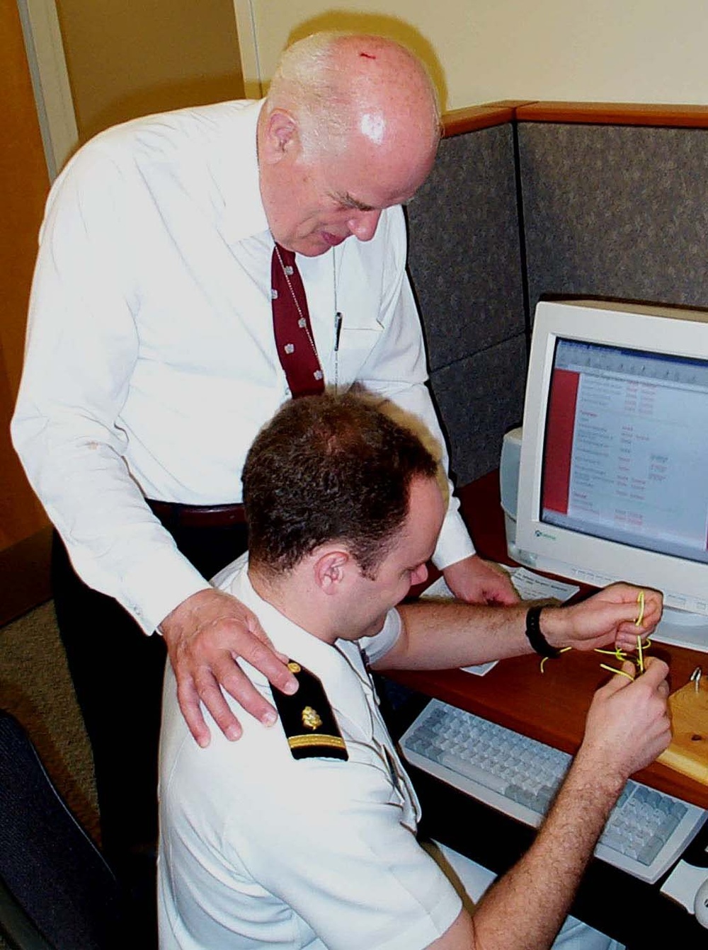 Navy Ensign Learns Surgical Knot Tying from Doctor at Medical Simulation Center