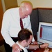 Navy Ensign Learns Surgical Knot Tying from Doctor at Medical Simulation Center