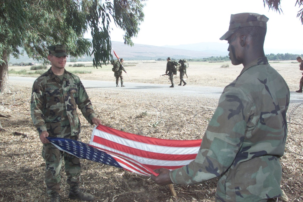 Marines Fold American Flag at Sunset During Exercise in Tunisia
