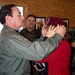 Medal of Honor Recipient Helps Singer Adjust Beret During Kosovo Visit
