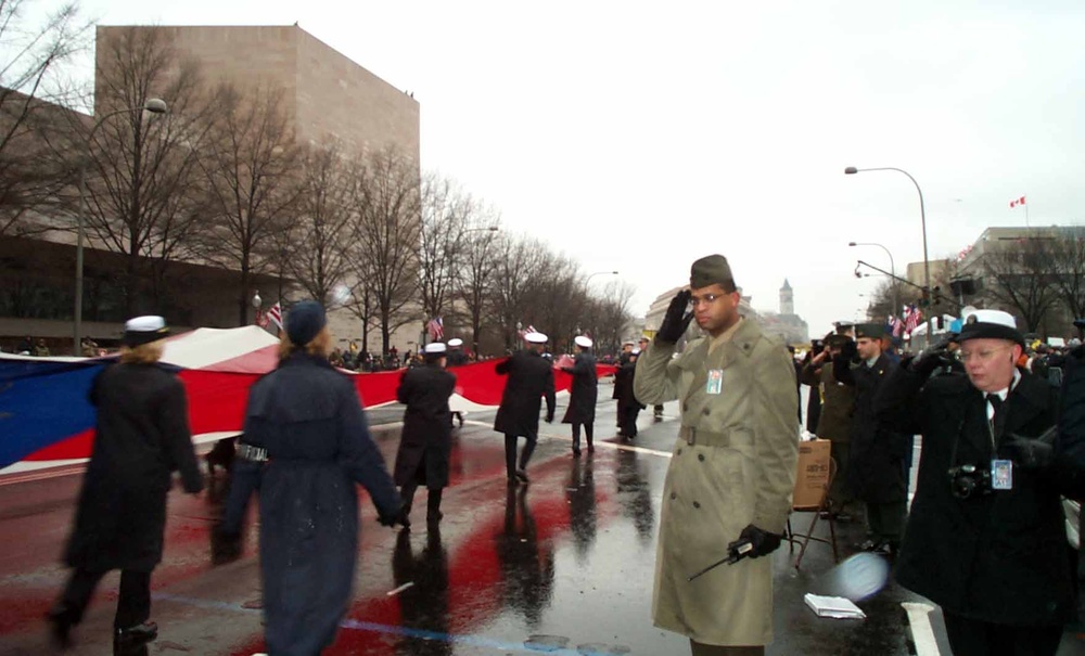 Military Members Salute as Oversized Flag Marches Down Pennsylvania Avenue