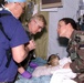 U.S. Soldiers Tend to Wounded Albanian Civilian in Kosovo