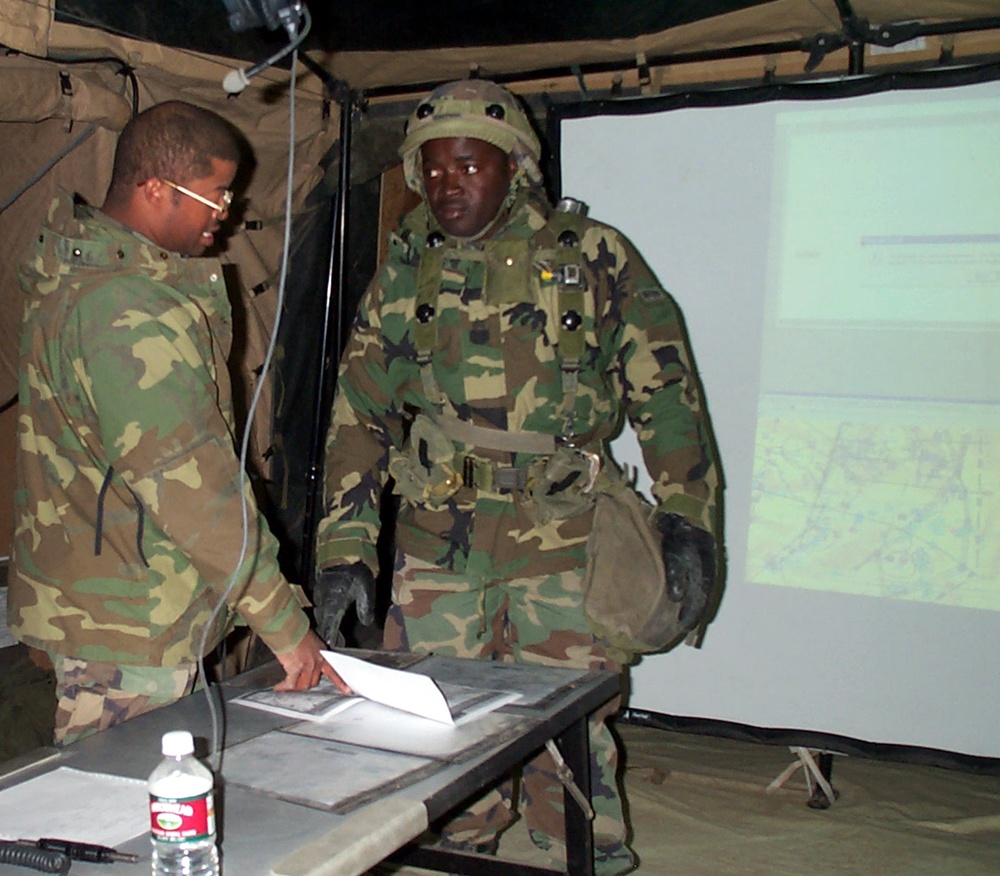 Battalion Intelligence NCO Briefs Soldier During Division Capstone Exercise