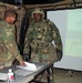 Battalion Intelligence NCO Briefs Soldier During Division Capstone Exercise