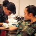 Army Medic Draws Blood Sample from National Guardsman Deploying to Bosnia