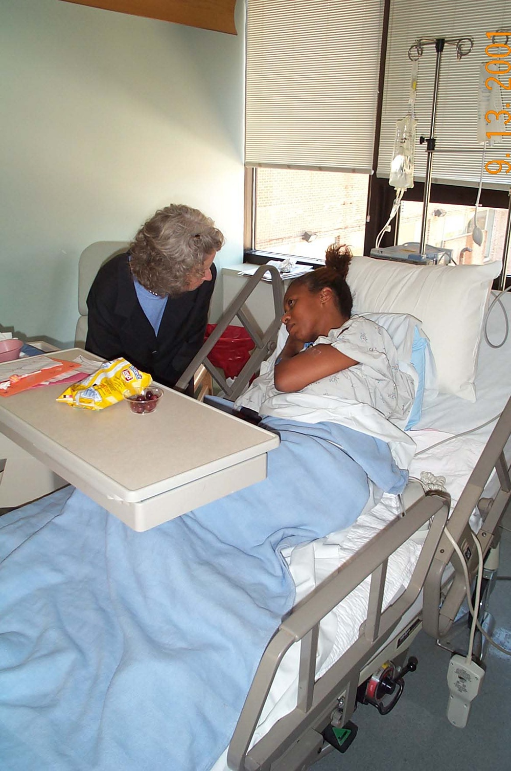 Rumsfeld Comforts Pentagon Attack Victim at Arlington Hospital