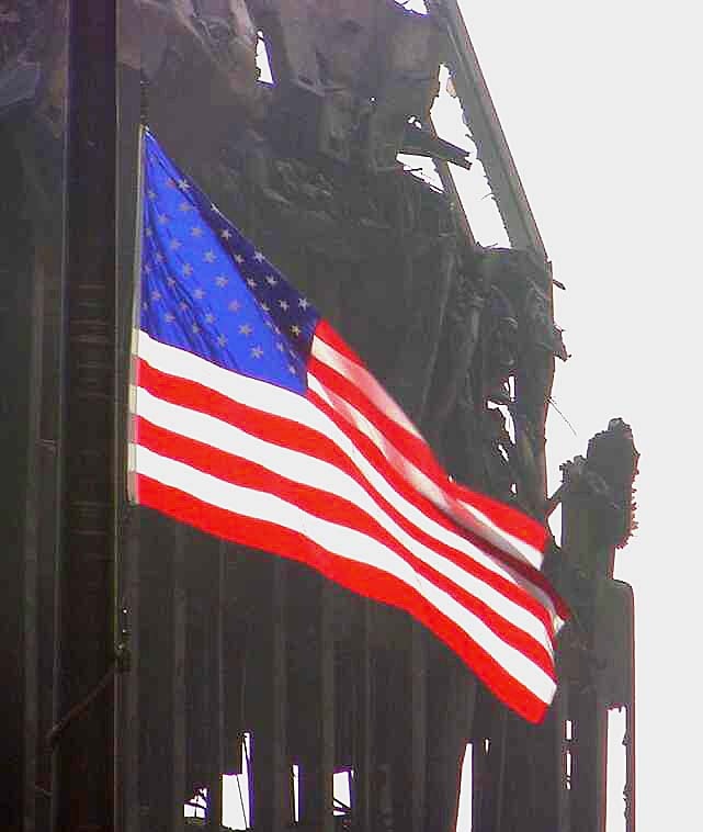 American Flag Flies Defiantly Over Ruins of 9/11 Attack