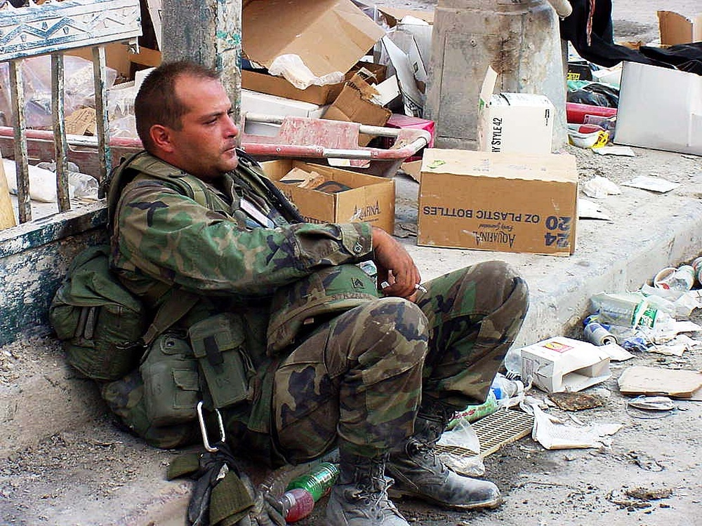 National Guard Soldier Rests Amid Debris of 9/11 Attacks