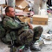 National Guard Soldier Rests Amid Debris of 9/11 Attacks