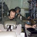 Air Force Crew Member Adjusts Broadcast Signal During Training Mission