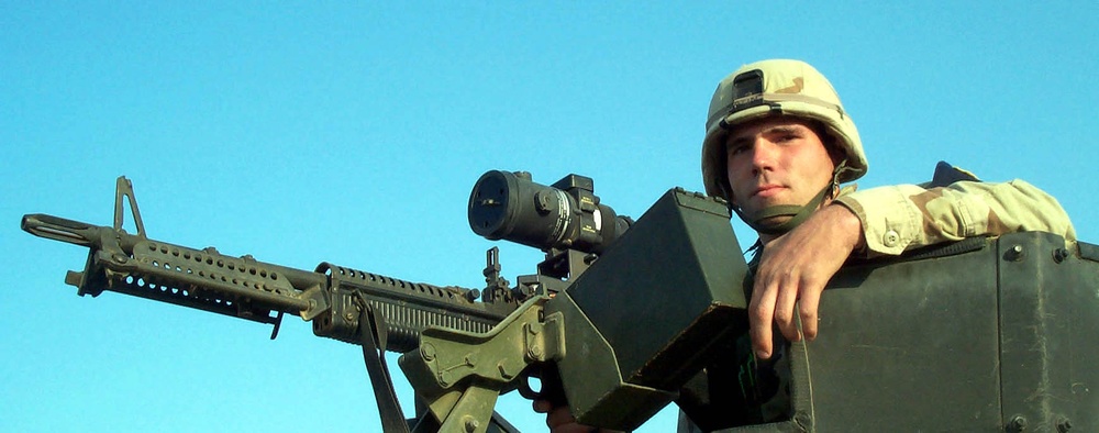 Airman Vigilantly Scans Horizon with Night-Vision Equipped M-60 Machine Gun