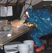 Hazmat-Suited Specialist Tests Samples from Survey Team