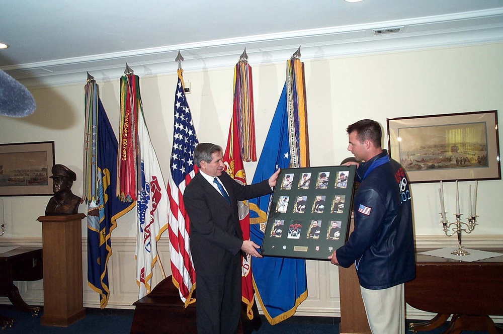Wolfowitz Accepts Collage of Military Olympians on Behalf of Rumsfeld