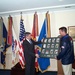 Wolfowitz Accepts Collage of Military Olympians on Behalf of Rumsfeld