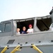 Children Peek at Parents from Military Watercraft at Air Force Open House