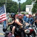 Biker Carries American Flag in Rolling Thunder Ride