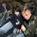 Airman Demonstrates Fighter Jet Maintenance to Civilian Visitors at Sheppard Air Force Base