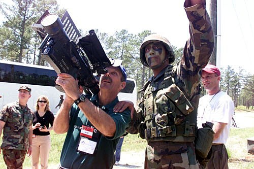 Civilian Businessman Gets Hands-On with Stinger Missile at Military Base