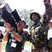 Civilian Businessman Gets Hands-On with Stinger Missile at Military Base