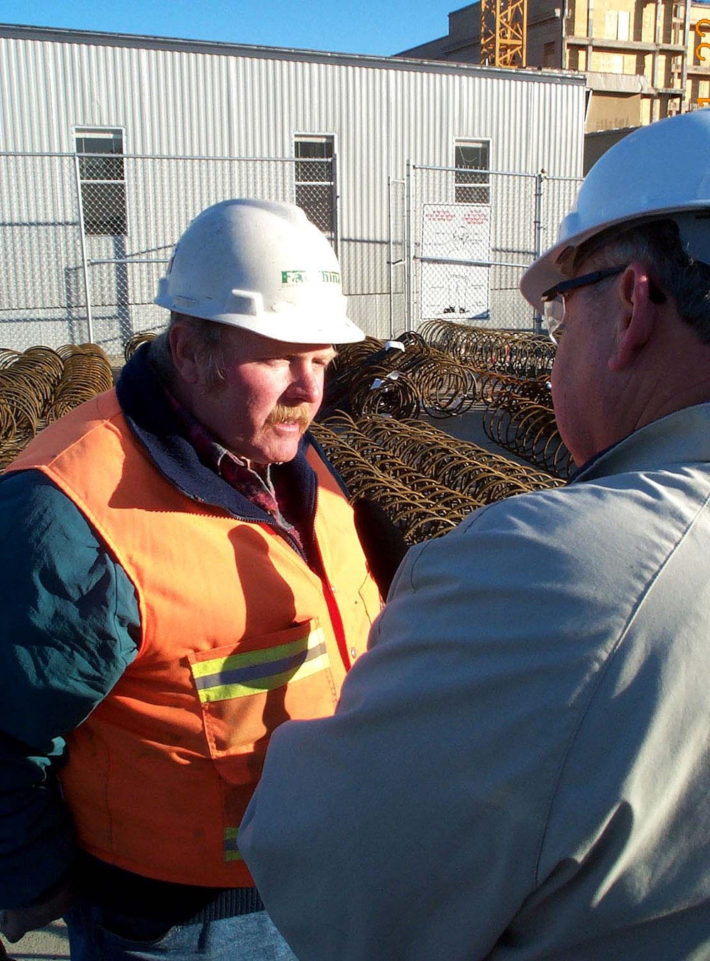Construction Superintendent Speaks with Reporter