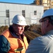 Construction Superintendent Speaks with Reporter