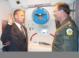Air Force NCO Re-enlists Aboard Rumsfeld's Plane