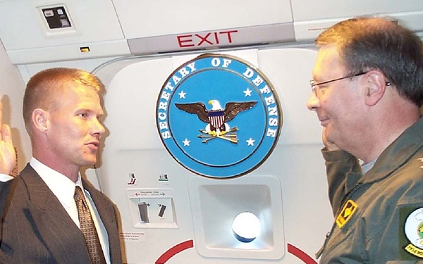 Air Force NCO Re-enlists Aboard Rumsfeld's Plane