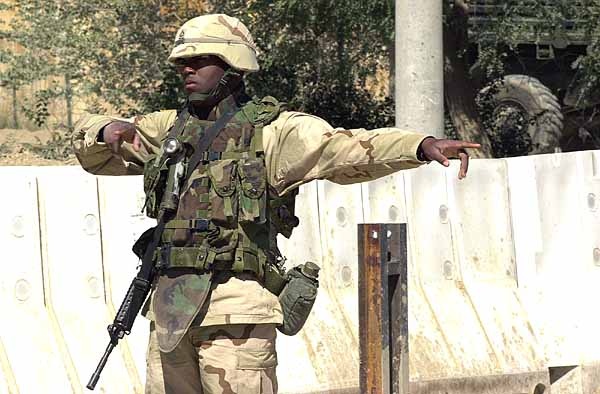 Soldier Directs Traffic at Bagram Air Base in Afghanistan
