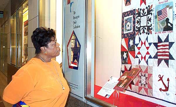 EPA Employee Examines 9/11 Memorial Quilt